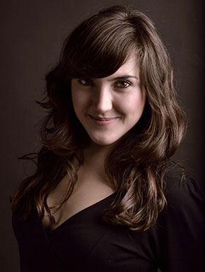 Portrait of Maria Toledo against a dark background